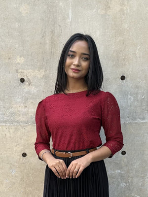 woman wearing elegant maroon lace top trendy buzz