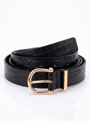 A black crocodile-embossed leather belt with a polished gold-tone metal buckle, coiled on a reflective white surface.