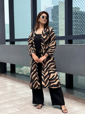 Woman wearing a zebra print Shrug in an urban setting