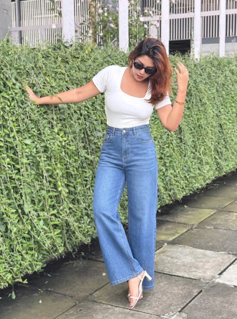 Women's Trendy Wide Leg Jeans in Dark Blue with high-waist fit, premium denim fabric, front and back pockets, and belt loops by Trendy Buzz.