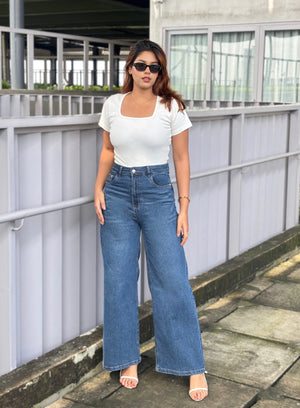 Women's Trendy Wide Leg Jeans in Dark Blue with high-waist fit, premium denim fabric, front and back pockets, and belt loops by Trendy Buzz.