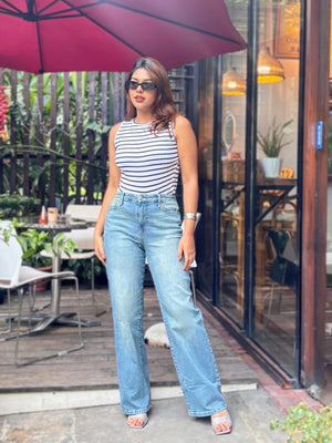 Women's Trendy Wide Leg Jeans in Mid Tint Blue with high-waist fit, premium denim fabric, front and back pockets, and belt loops by Trendy Buzz.