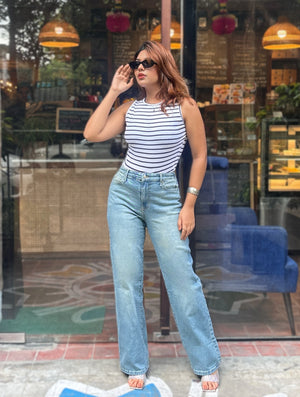 Women's Trendy Wide Leg Jeans in Mid Tint Blue with high-waist fit, premium denim fabric, front and back pockets, and belt loops by Trendy Buzz.