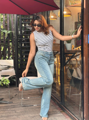 Women's Trendy Wide Leg Jeans in Mid Tint Blue with high-waist fit, premium denim fabric, front and back pockets, and belt loops by Trendy Buzz.