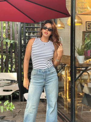 Women's Trendy Wide Leg Jeans in Mid Tint Blue with high-waist fit, premium denim fabric, front and back pockets, and belt loops by Trendy Buzz.