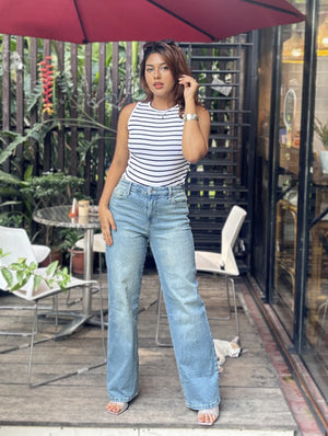 Women's Trendy Wide Leg Jeans in Mid Tint Blue with high-waist fit, premium denim fabric, front and back pockets, and belt loops by Trendy Buzz.