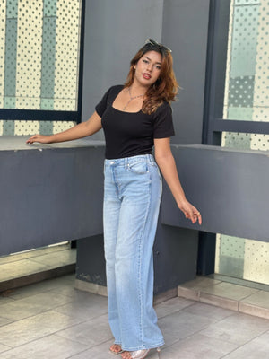 Women's Wide Leg Baggy Jeans in Light Blue with high-waist fit, back elastic waistband, front and back pockets, belt loops, and premium denim fabric by Trendy Buzz