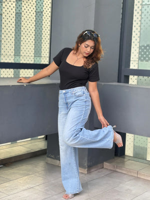 Women's Wide Leg Baggy Jeans in Light Blue with high-waist fit, back elastic waistband, front and back pockets, belt loops, and premium denim fabric by Trendy Buzz
