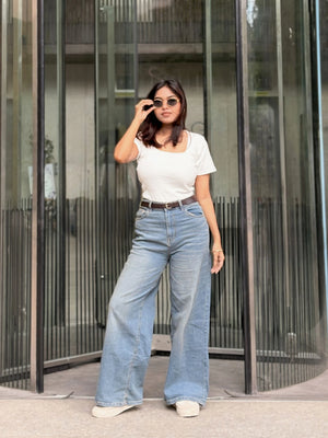 Women's Wide Leg Baggy Jeans in Mid Blue with high-waist fit, back elastic waistband, front and back pockets, belt loops, and premium denim fabric by Trendy Buzz