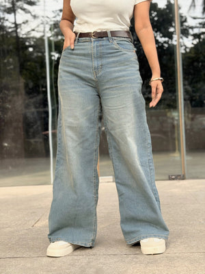 Women's Wide Leg Baggy Jeans in Mid Blue with high-waist fit, back elastic waistband, front and back pockets, belt loops, and premium denim fabric by Trendy Buzz