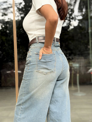 Women's Wide Leg Baggy Jeans in Mid Blue with high-waist fit, back elastic waistband, front and back pockets, belt loops, and premium denim fabric by Trendy Buzz