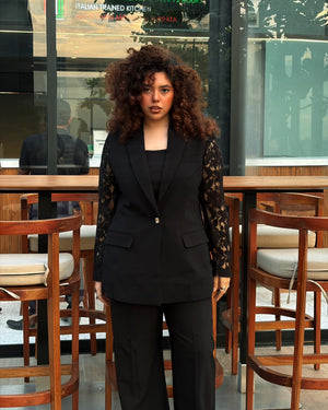 Women wearing premium black lace sleeve blazer with gold-tone button