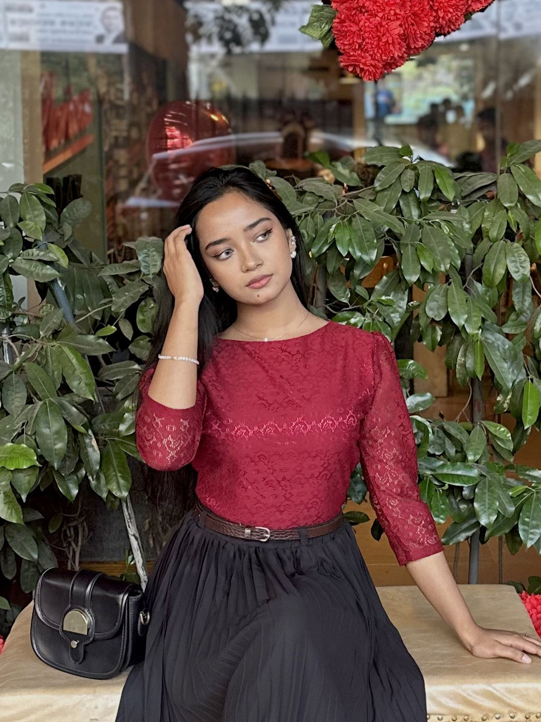 woman wearing elegant maroon lace top trendy buzz