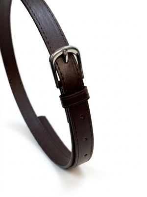 A close-up of a dark brown leather belt with a silver-tone metal buckle, arranged in a loop on a clean white background.