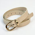 A light beige faux leather belt with a polished gold-tone metal buckle, neatly coiled on a white background.
