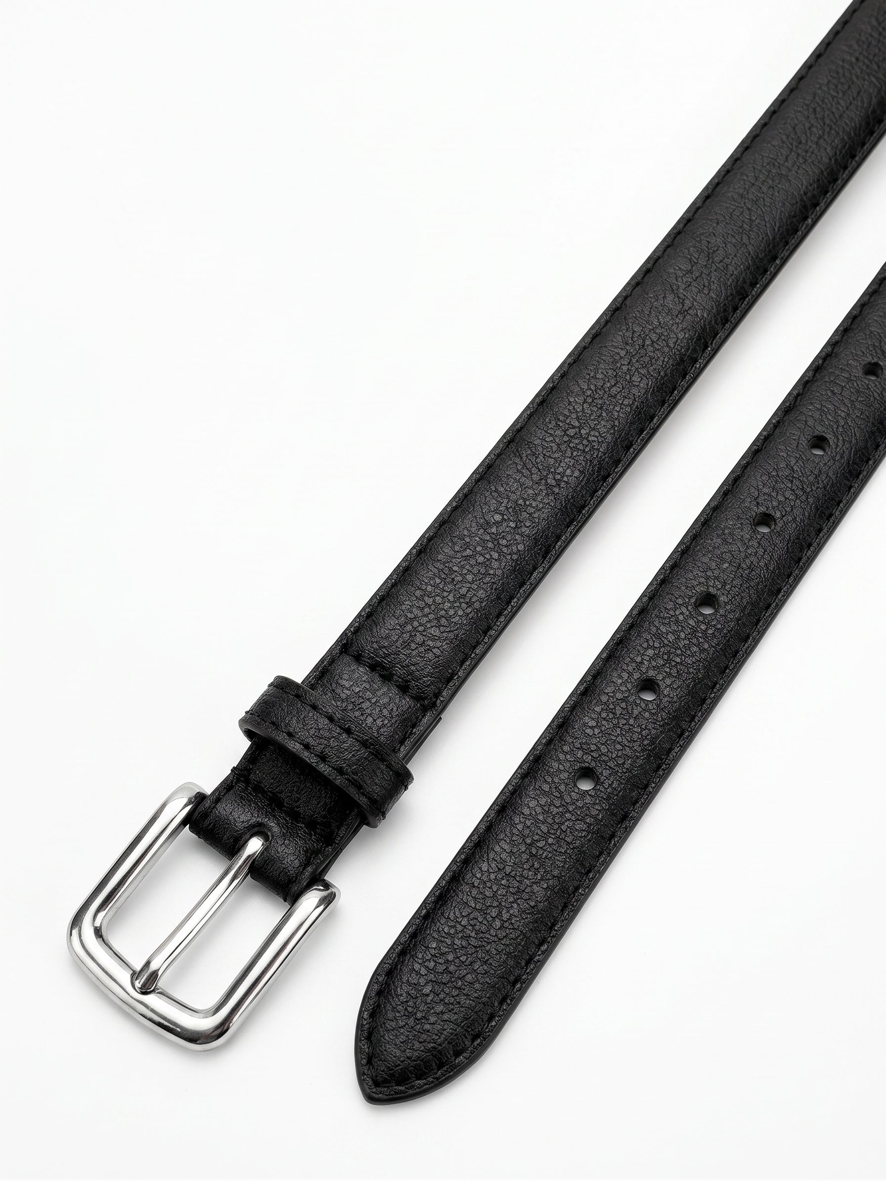 A close-up of a black textured leather watch strap with a silver-tone metal buckle, laid diagonally on a clean white background.