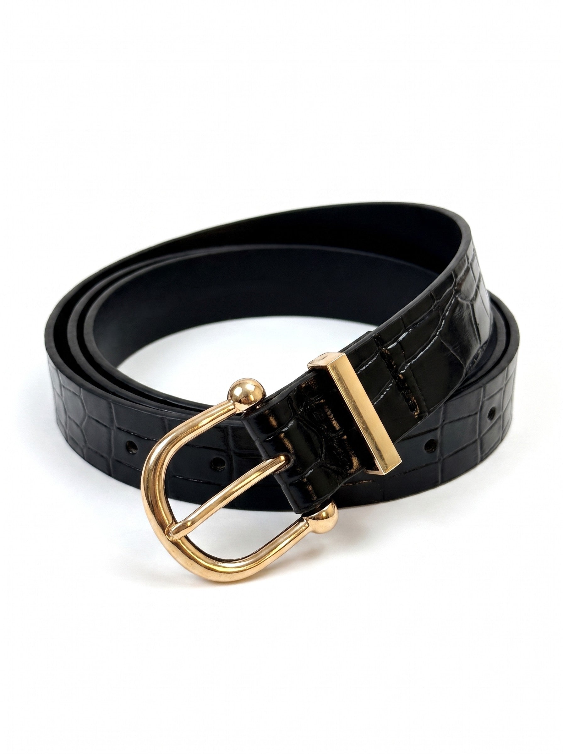 A black crocodile-embossed leather belt with a polished gold-tone buckle, coiled on a clean white background.