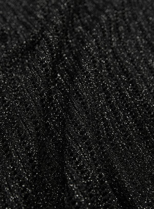 Woman wearing a black textured mesh top which is glittery for party use. trendy buzz bd.