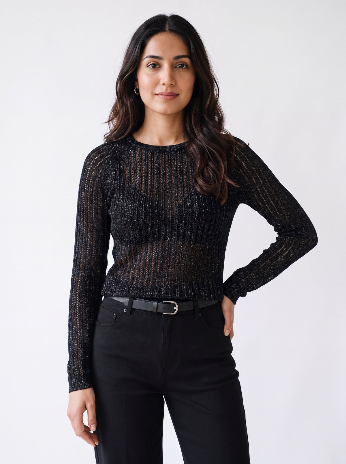 Woman wearing a black textured mesh top which is glittery for party use. trendy buzz bd.