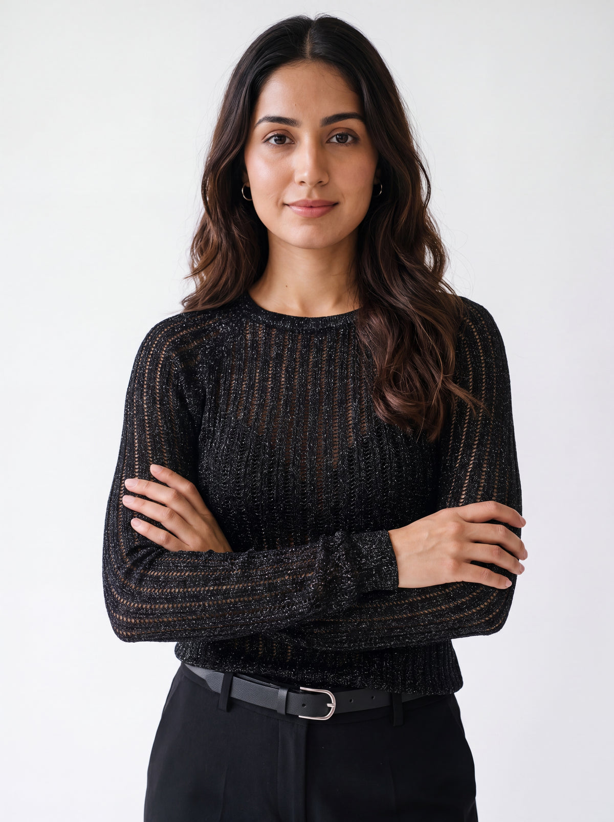Woman wearing a black textured mesh top which is glittery for party use. trendy buzz bd.