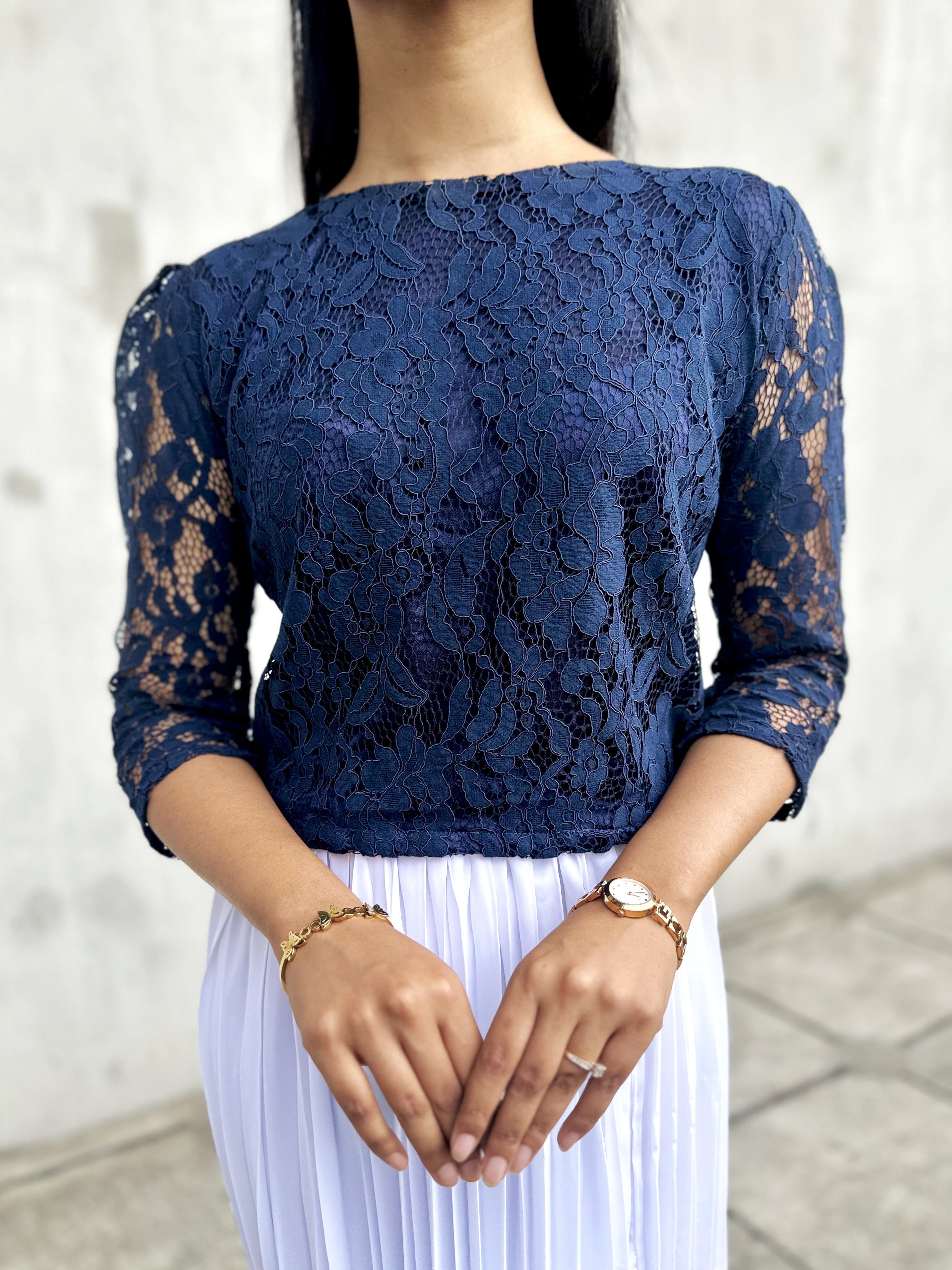 woman wearing navy blue lace top trendy buzz