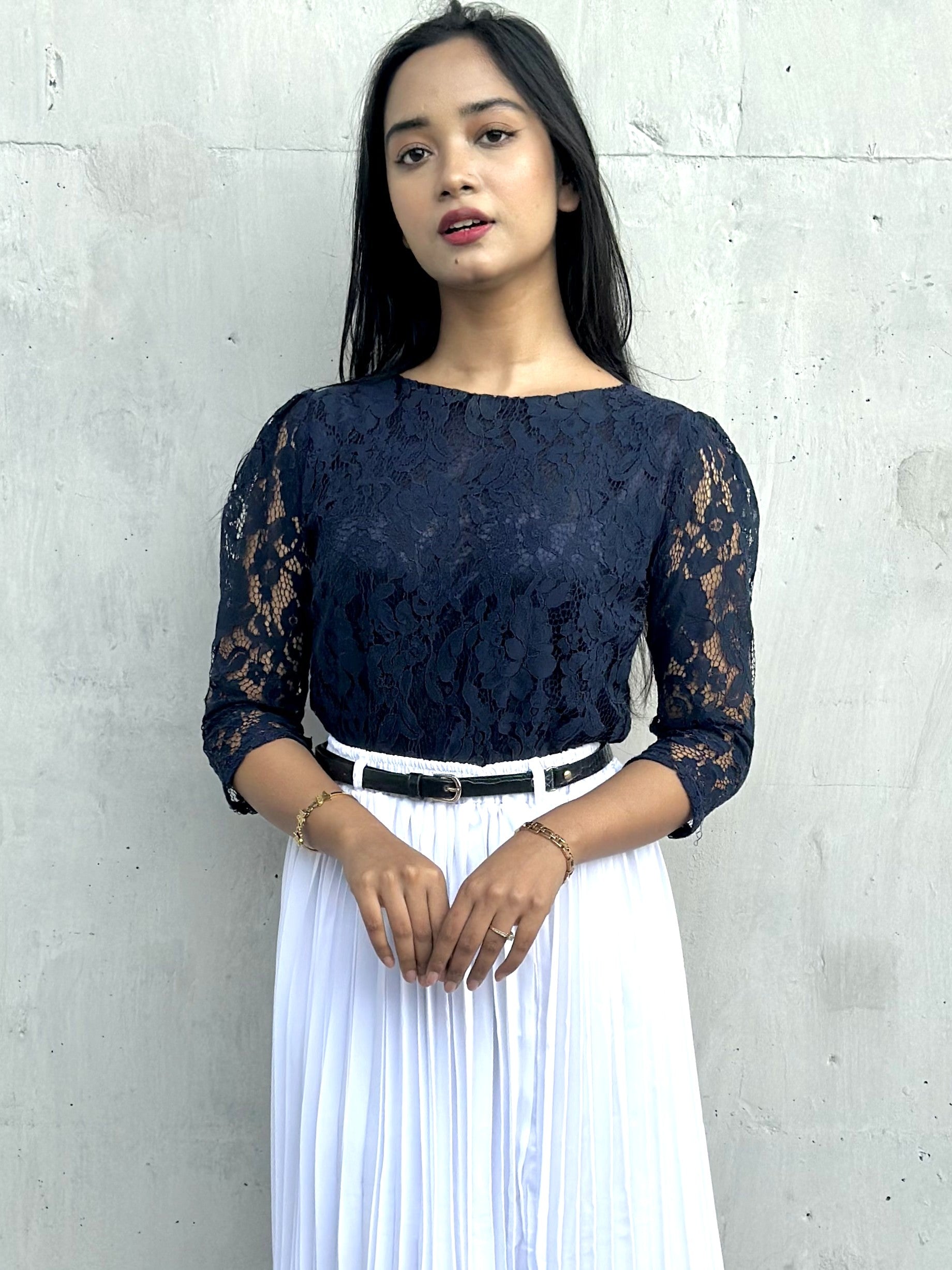 woman wearing navy blue lace top trendy buzz