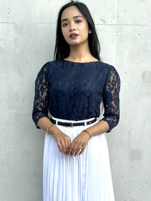 woman wearing navy blue lace top trendy buzz