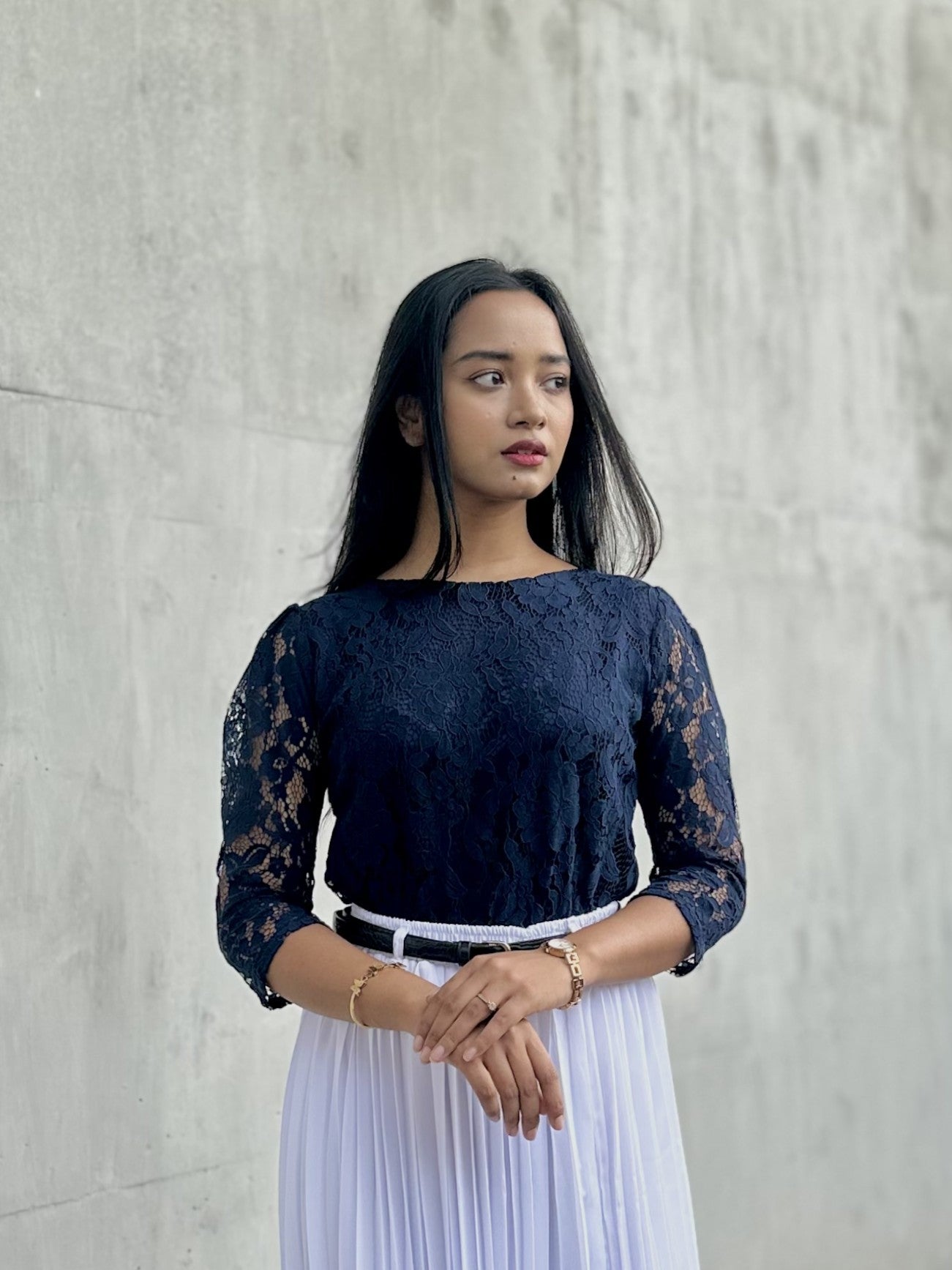 woman wearing navy blue lace top trendy buzz