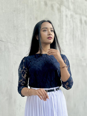 woman wearing navy blue lace top trendy buzz