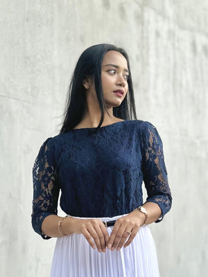 woman wearing navy blue lace top trendy buzz