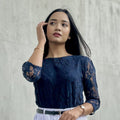 woman wearing navy blue lace top trendy buzz