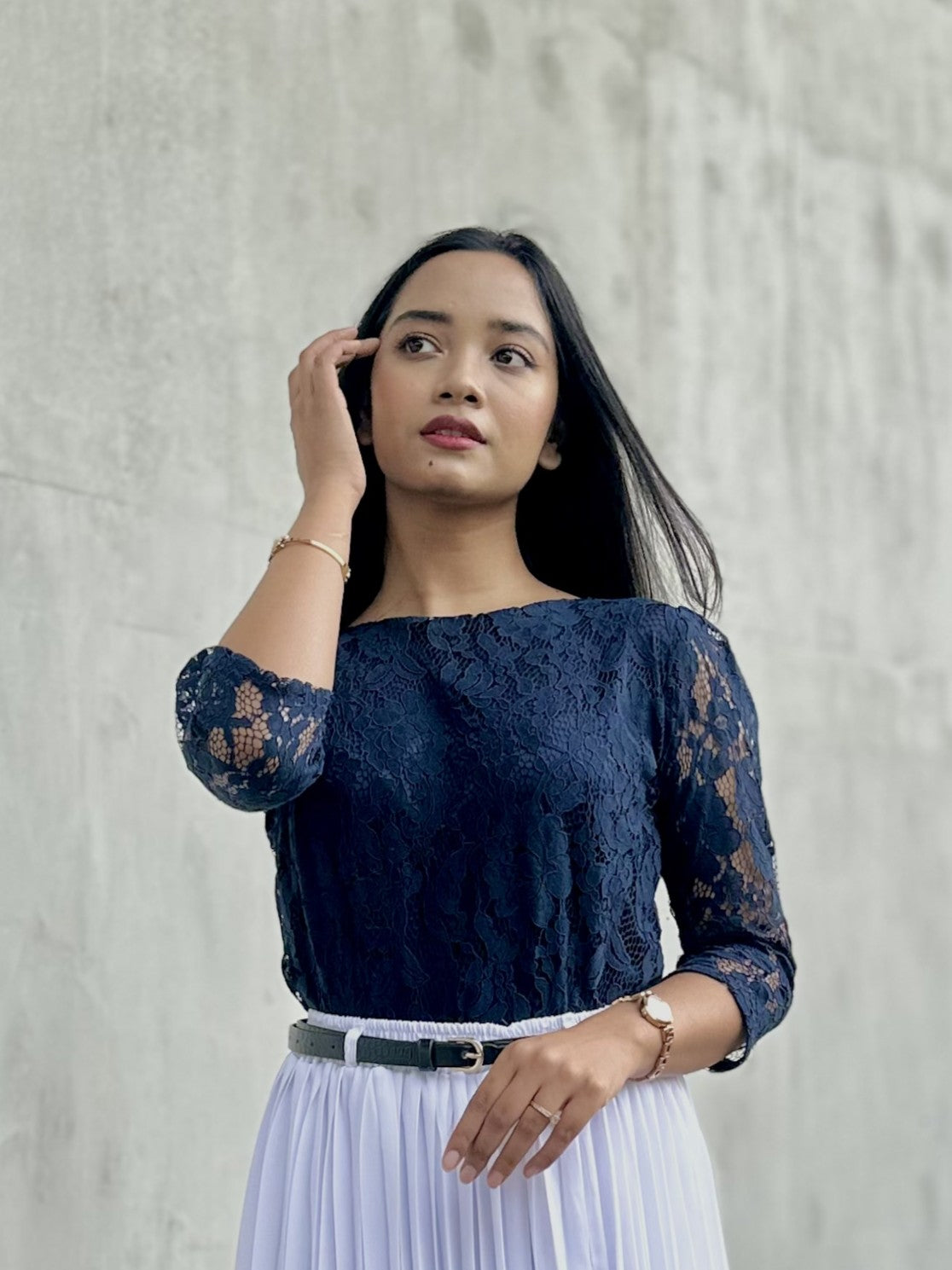 woman wearing navy blue lace top trendy buzz