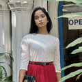 woman wearing white floral lace elegant top trendy buzz