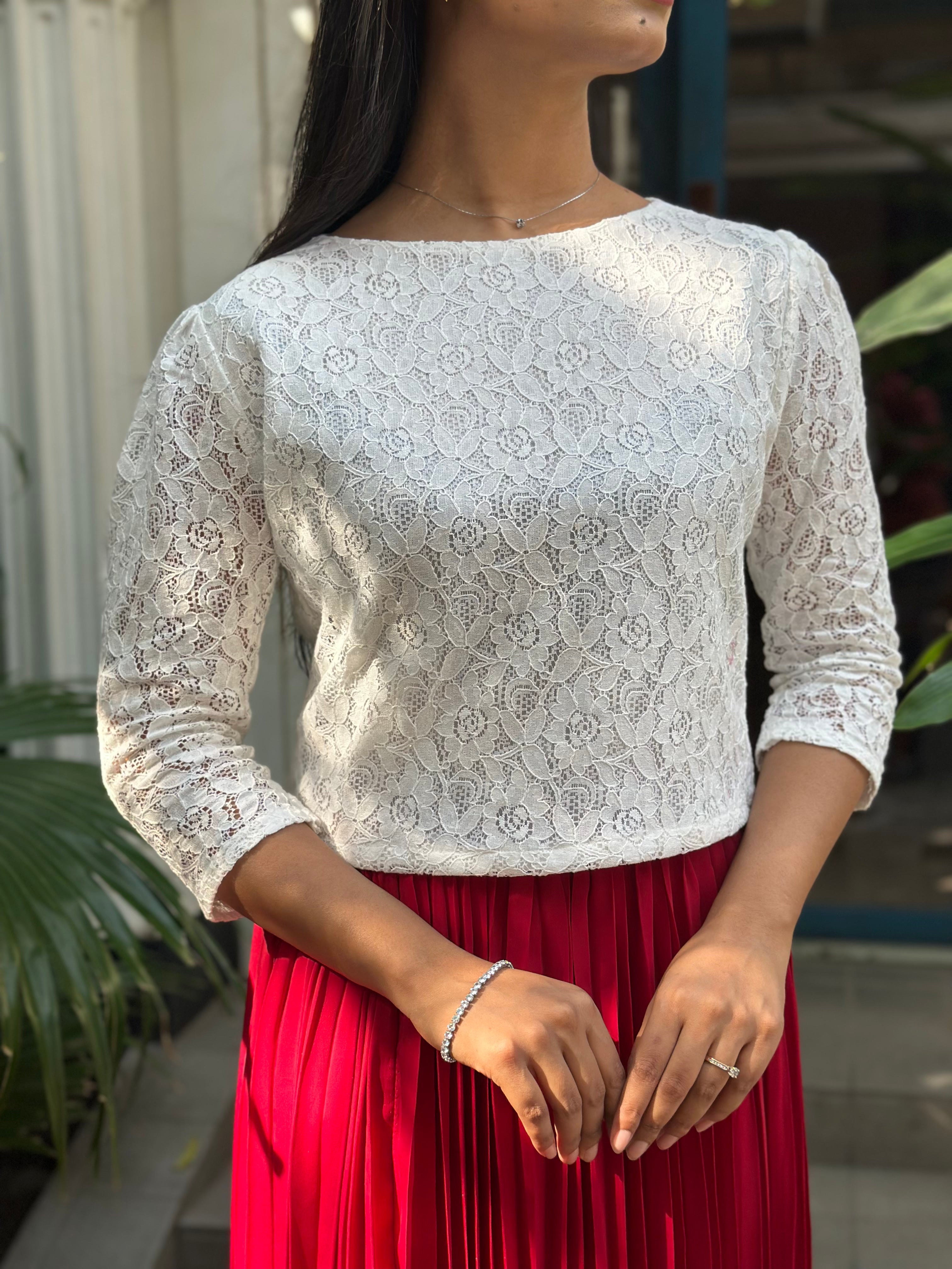 woman wearing white floral lace elegant top trendy buzz