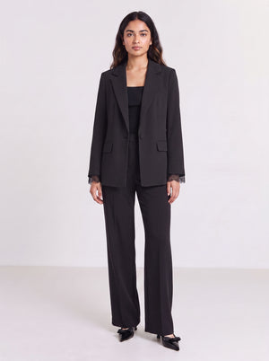 Premium black blazer with lace-attached sleeves for women. Trendy Buzz BD.