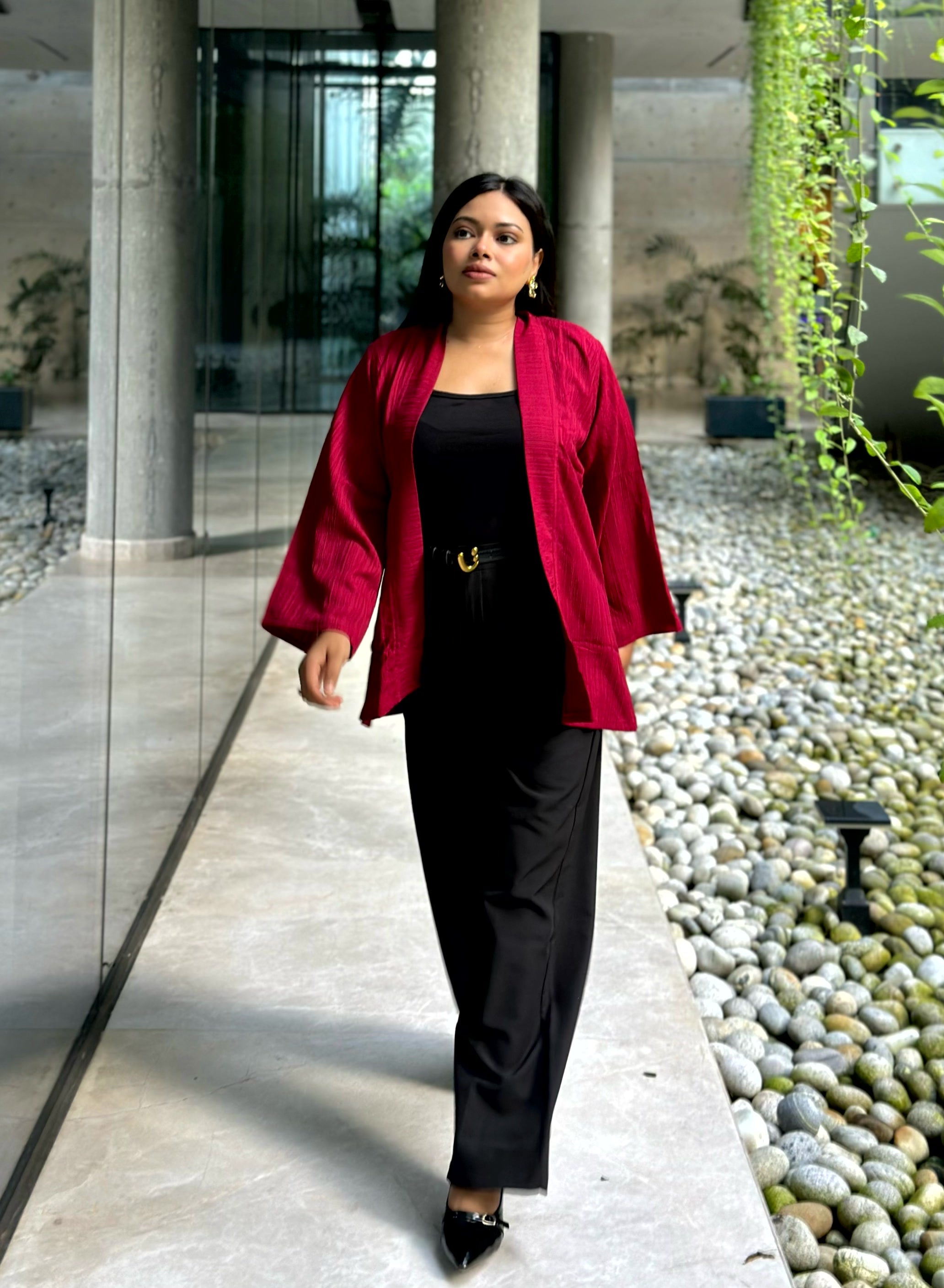 Woman wearing a premium maroon crinkle crepe kimono with textured popcorn fabric