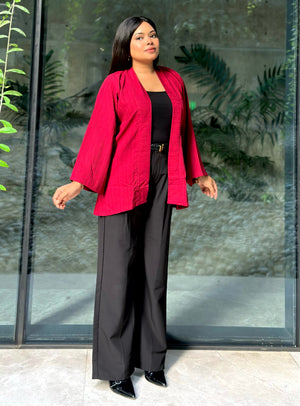 Woman wearing a premium maroon crinkle crepe kimono with textured popcorn fabric