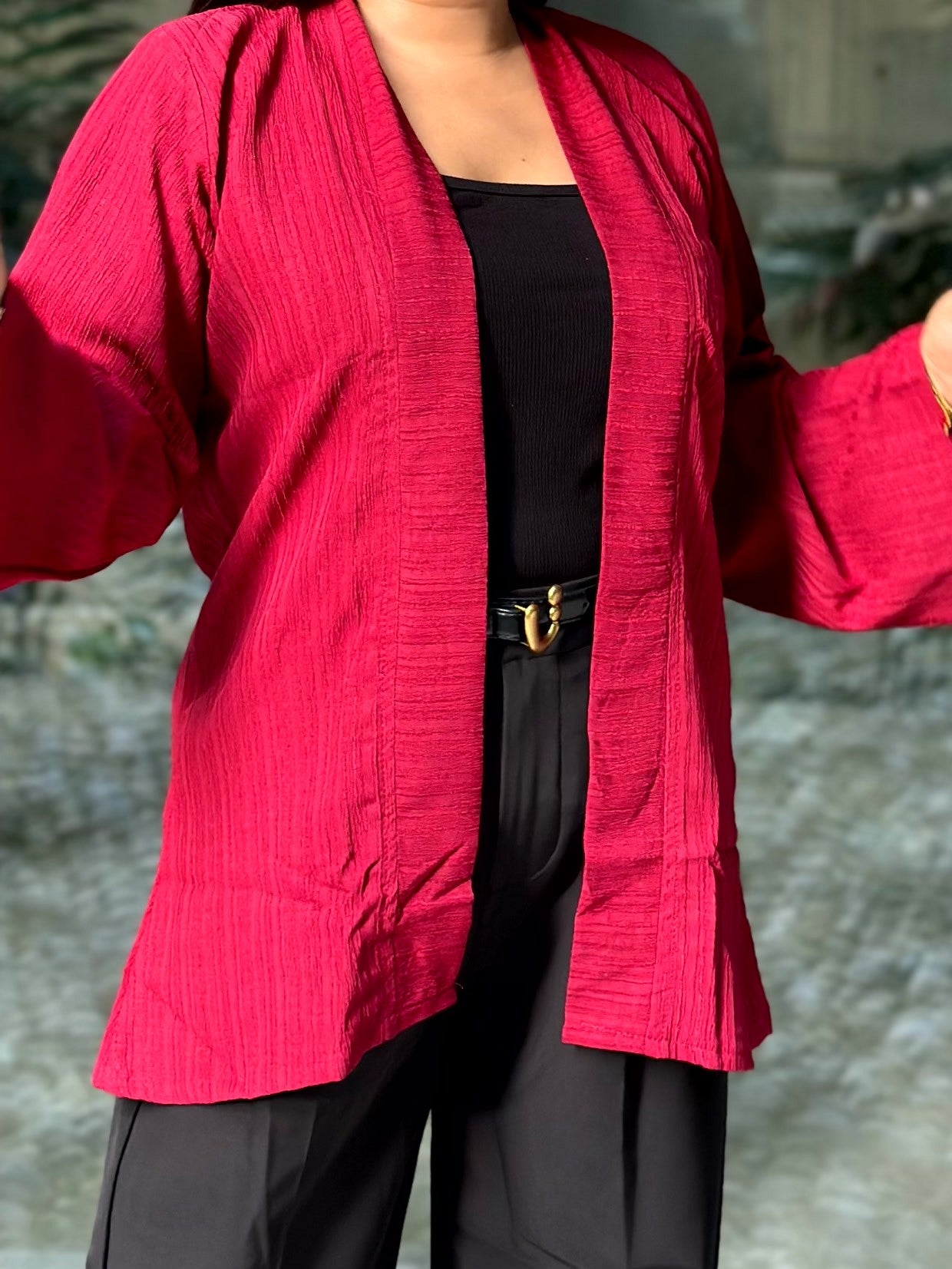 Woman wearing a premium maroon crinkle crepe kimono with textured popcorn fabric