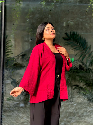 Woman wearing a premium maroon crinkle crepe kimono with textured popcorn fabric