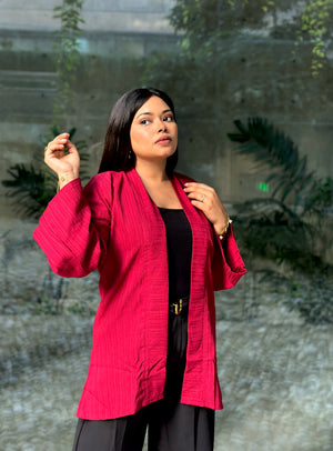 Woman wearing a premium maroon crinkle crepe kimono with textured popcorn fabric