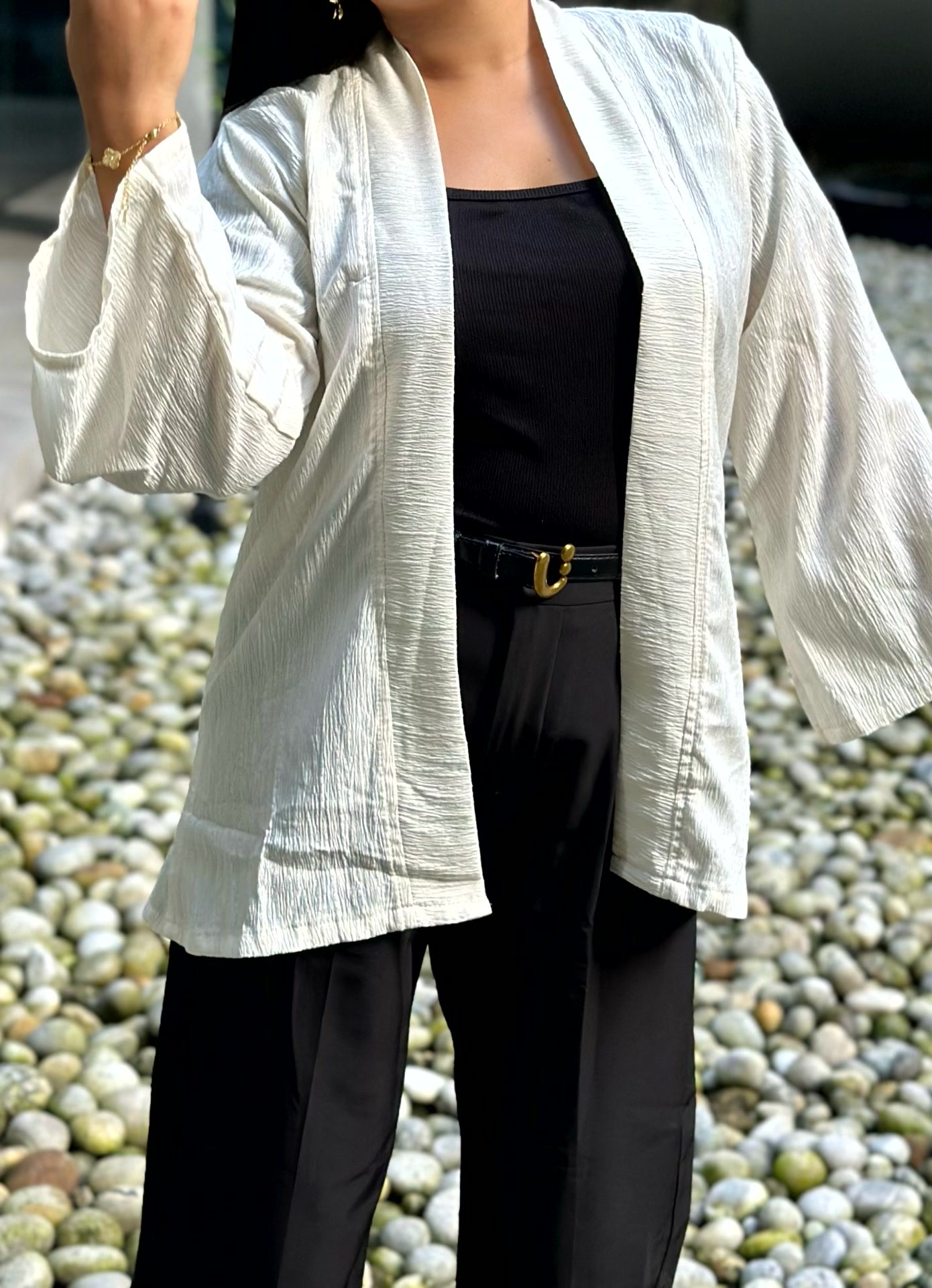 Woman wearing a premium milk white crinkle crepe kimono with textured popcorn fabric