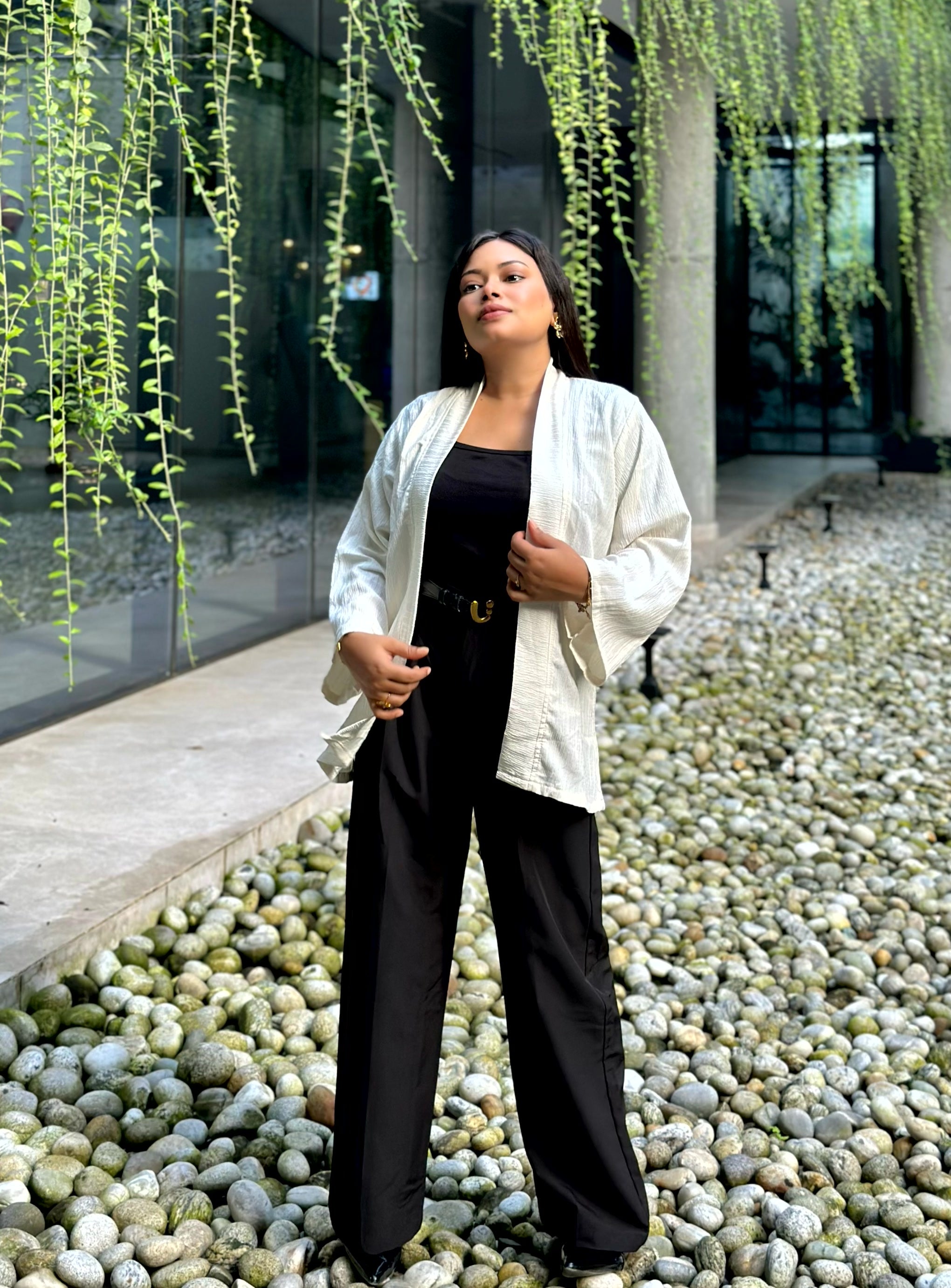 Woman wearing a premium milk white crinkle crepe kimono with textured popcorn fabric