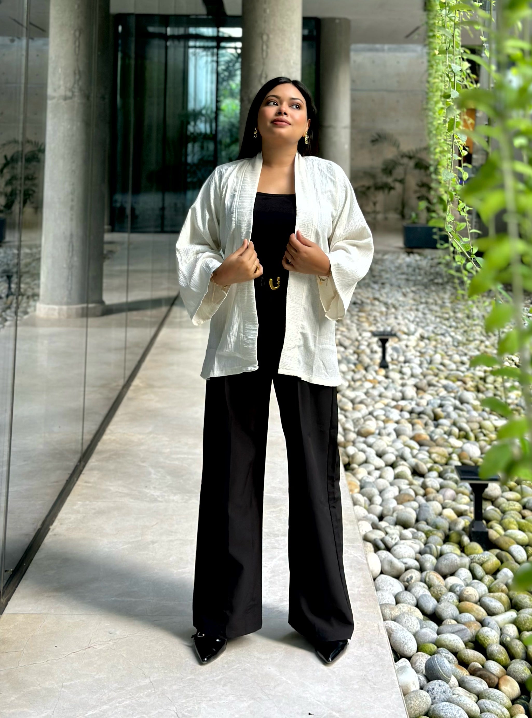 Woman wearing a premium milk white crinkle crepe kimono with textured popcorn fabric
