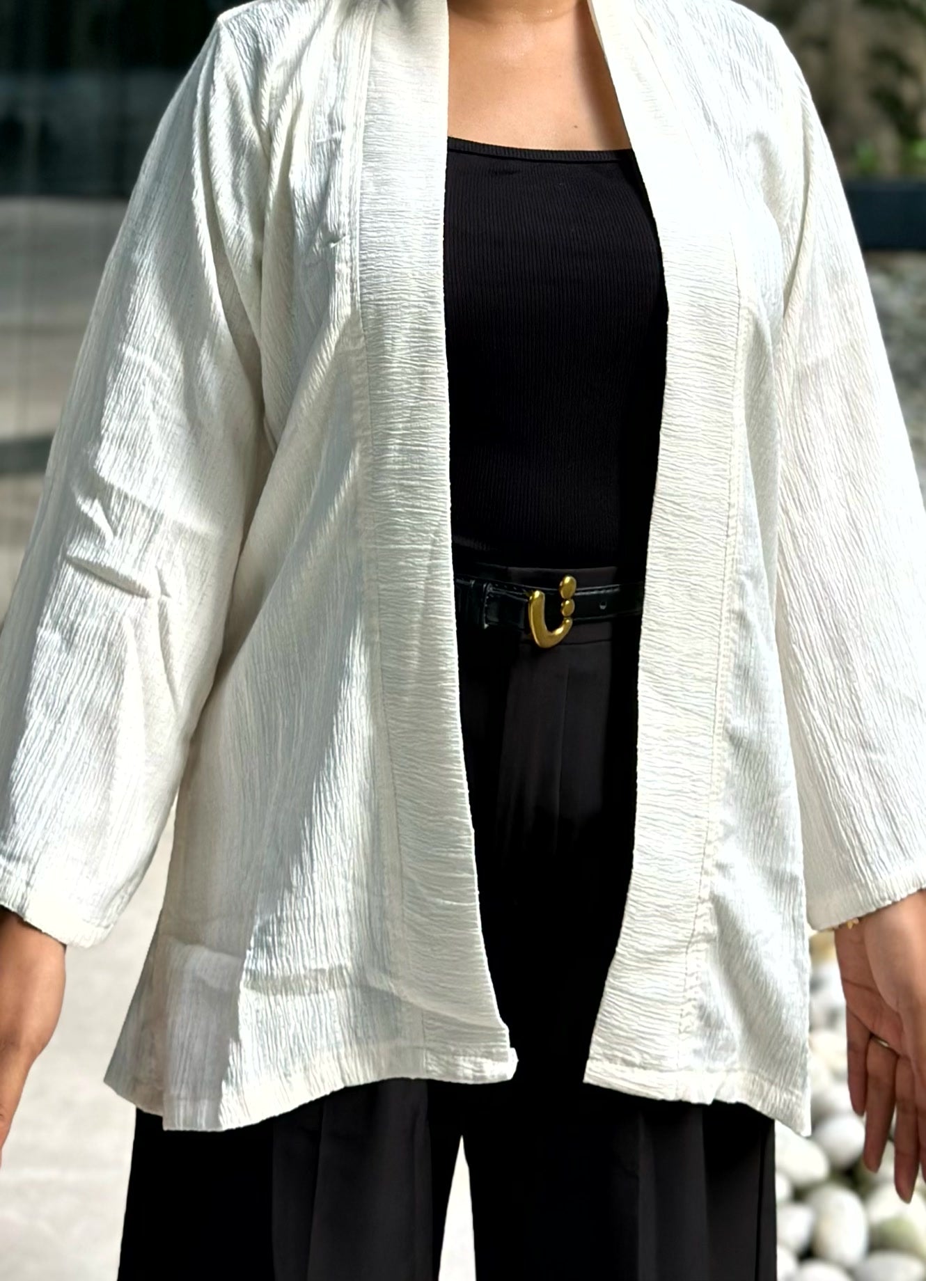 Woman wearing a premium milk white crinkle crepe kimono with textured popcorn fabric
