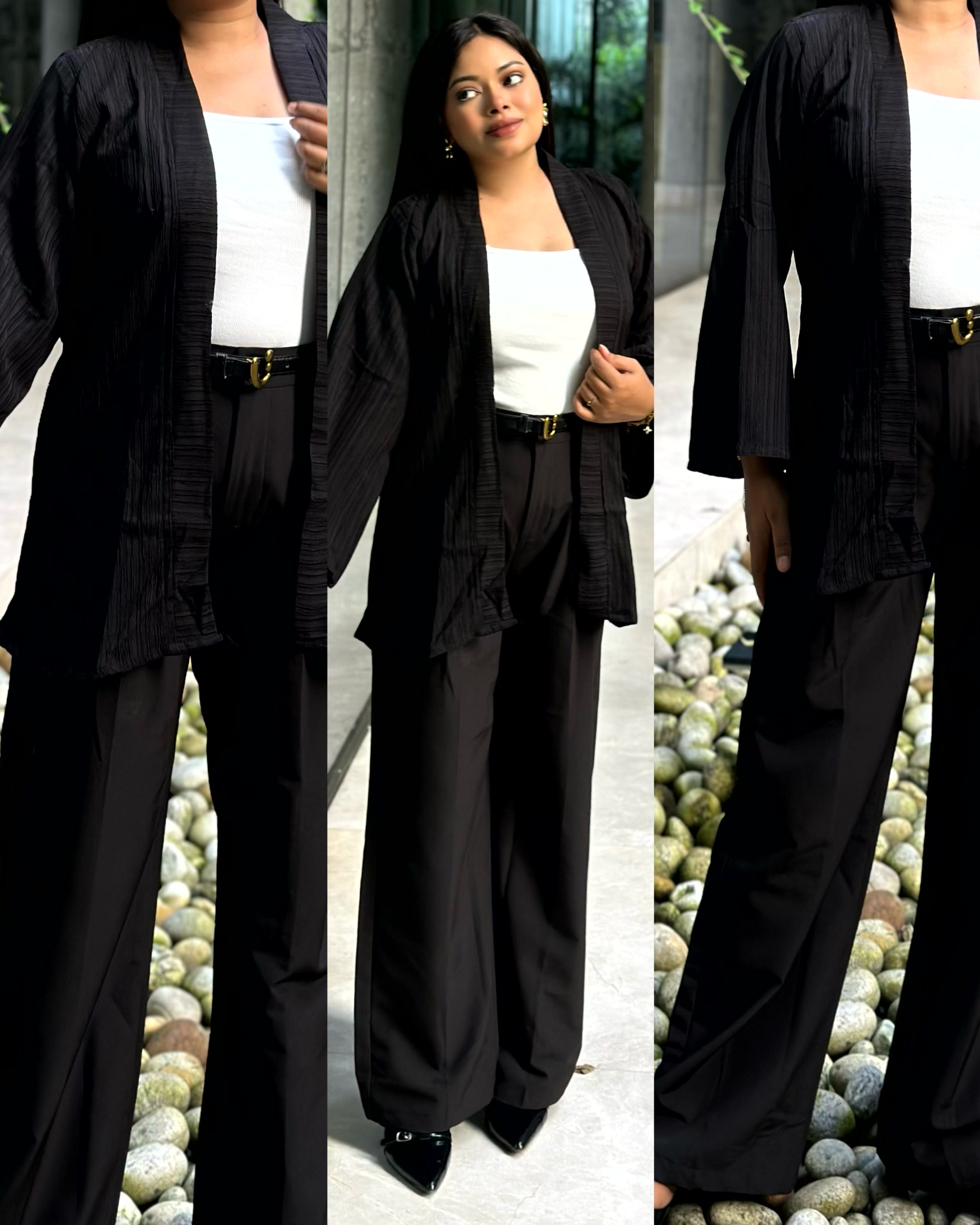 Woman wearing a premium solid black crinkle crepe kimono with textured popcorn fabric