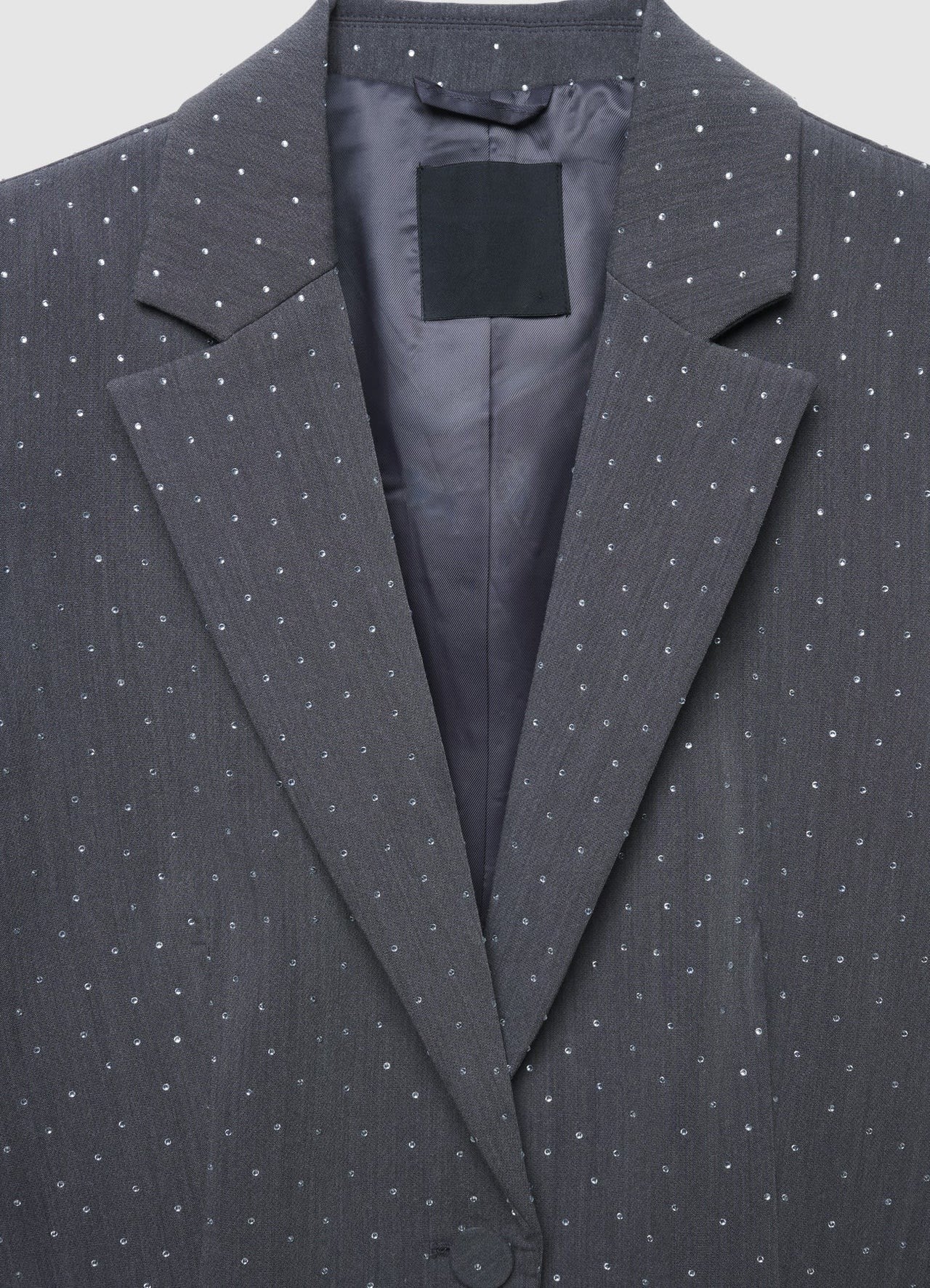 Ladies stone work party blazer in gray color styled with black wide leg pants and black crop top. Trendy Buzz BD.