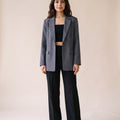 Ladies stone work party blazer in gray color styled with black wide leg pants and black crop top. Trendy Buzz BD.