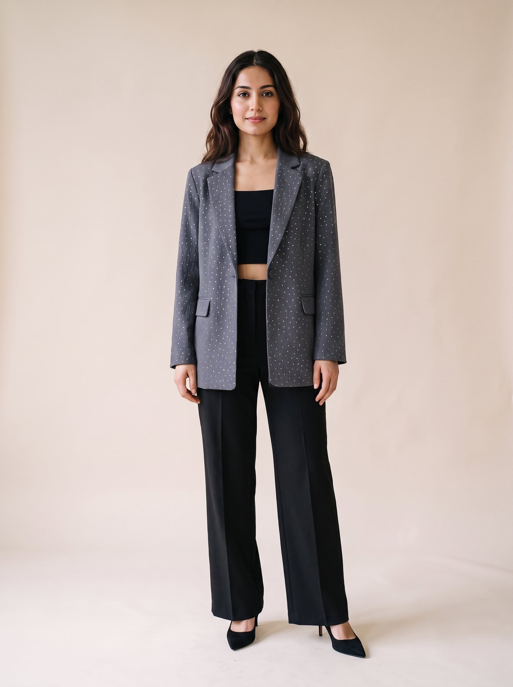 Ladies stone work party blazer in gray color styled with black wide leg pants and black crop top. Trendy Buzz BD.