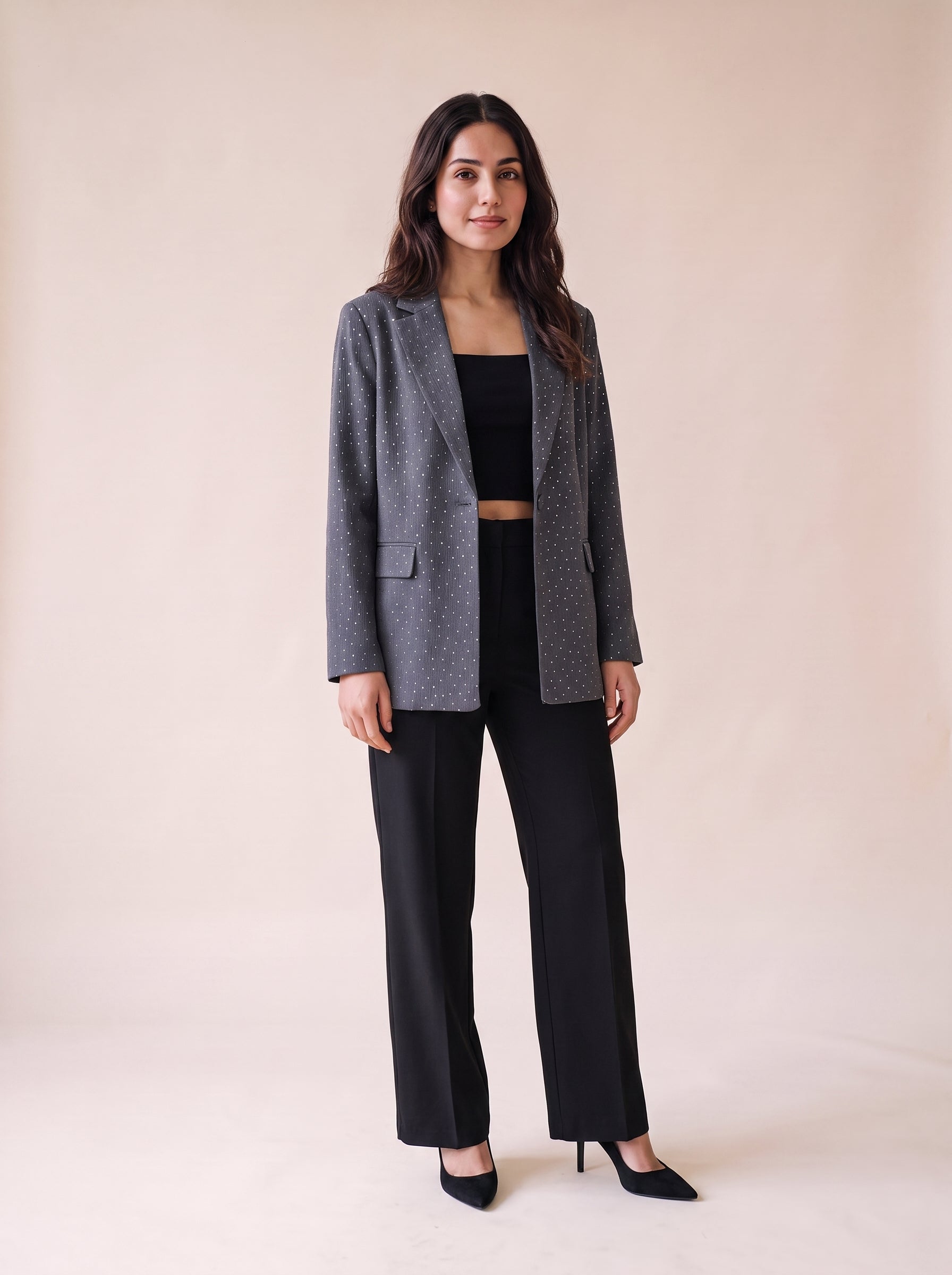 Ladies stone work party blazer in gray color styled with black wide leg pants and black crop top. Trendy Buzz BD.