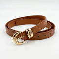 A brown leather belt with a polished gold-tone buckle, shown coiled on a clean white background.